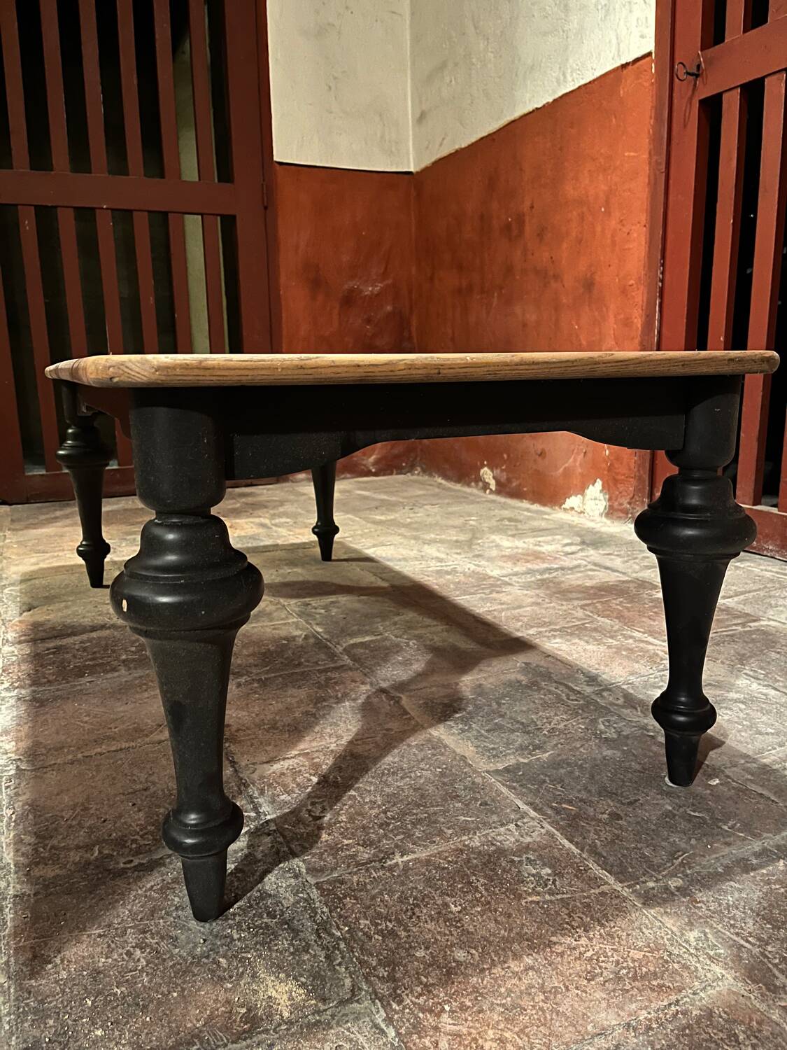 Coffee table with wooden top and black legs