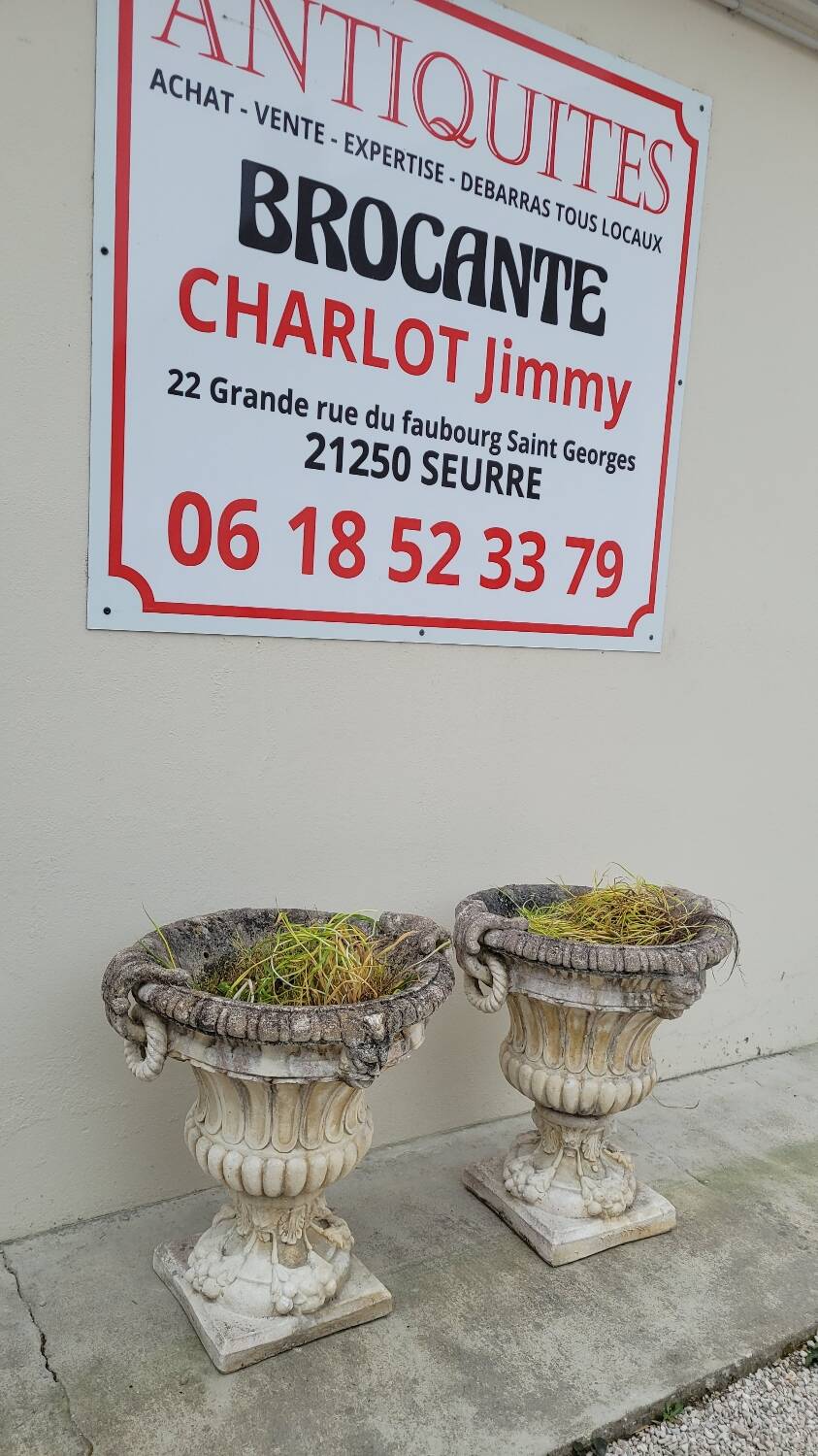 Pair of planter vases decorated with faces in reconstituted stone 1950s