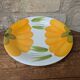 Round serving dish with hand-painted yellow flowers in ceramic TC Italy.