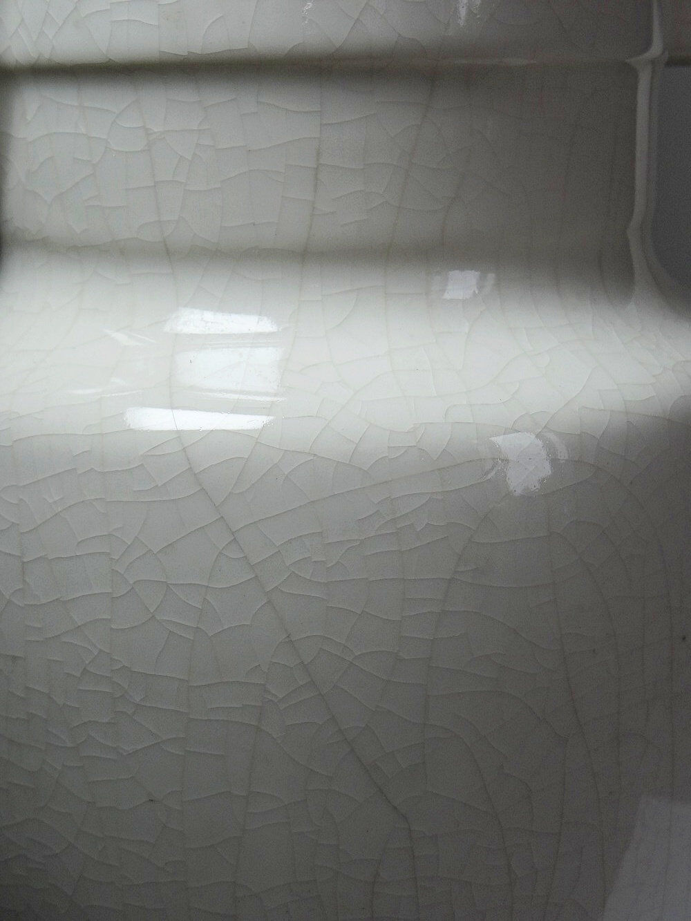 Large Art Deco toilet bowl, antique cracked faience.