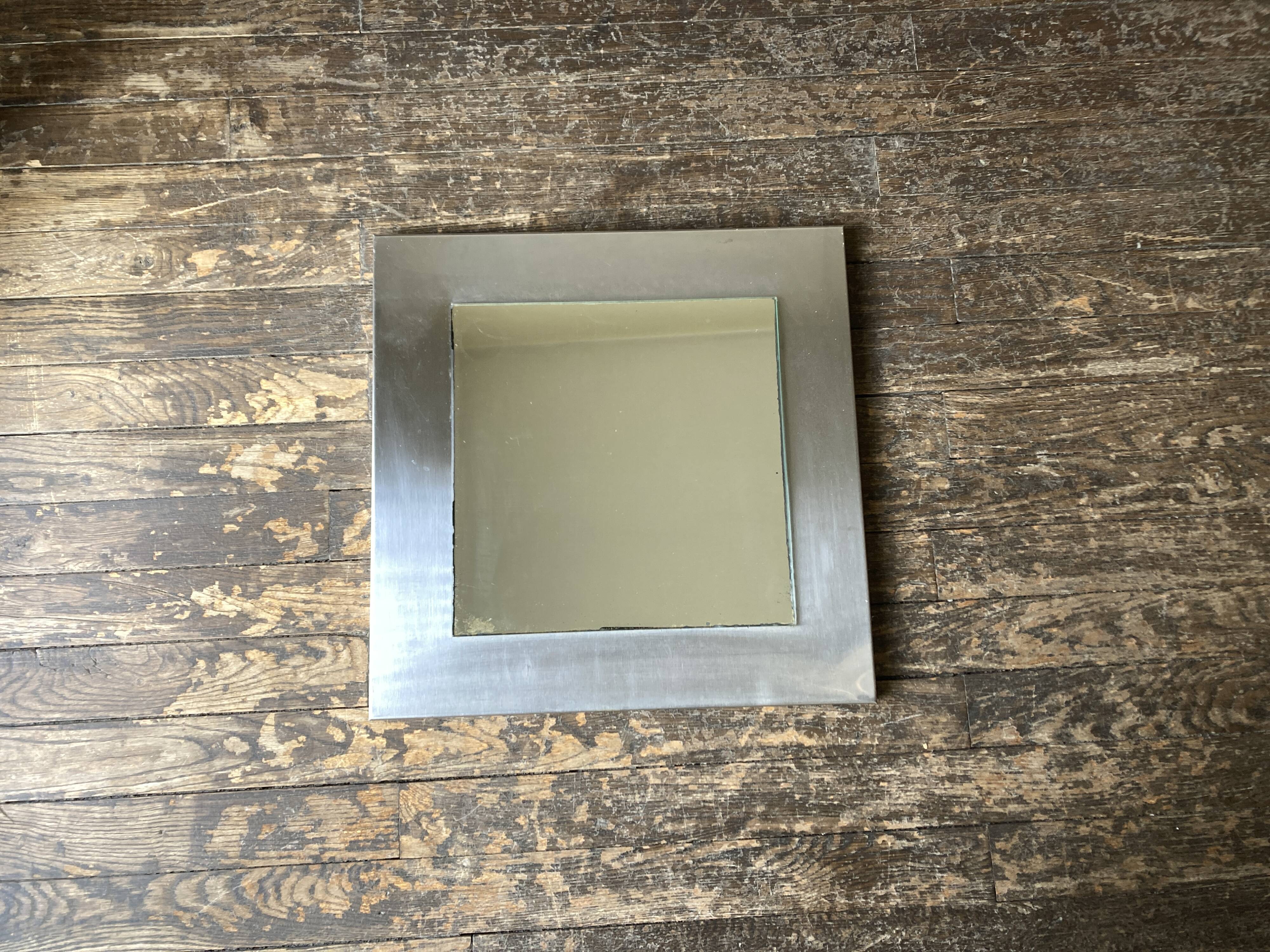 1970s space age steel mirror