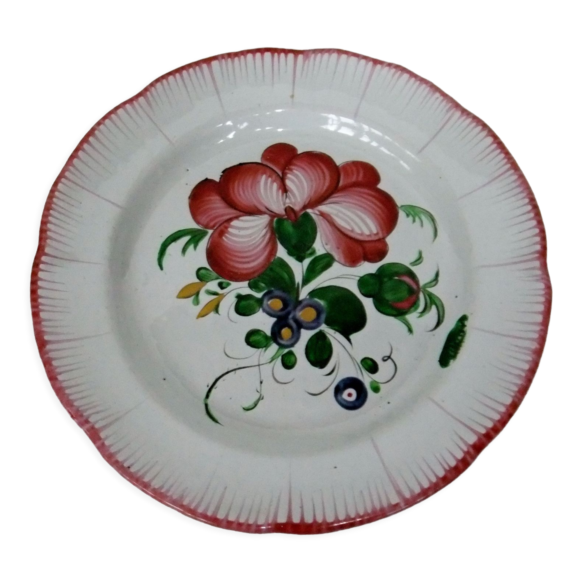Old earthenware plate of the East Strasbourg decorated with flowers