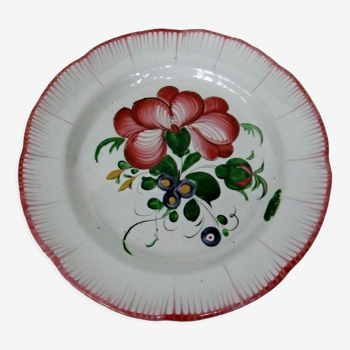 Old earthenware plate of the East Strasbourg decorated with flowers