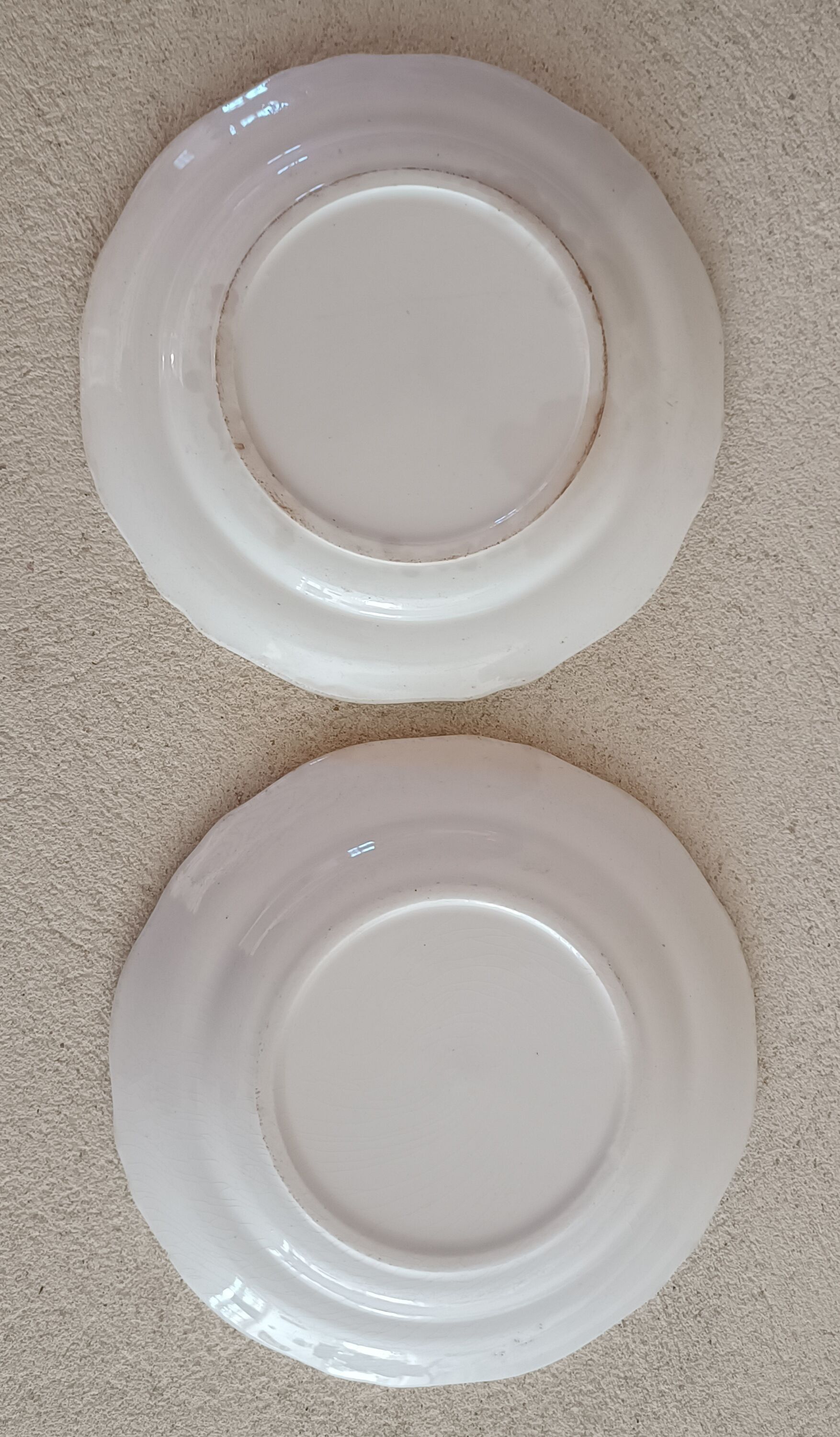 2 ivory plates with godrons