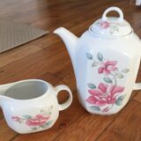 Vintage porcelain coffee or teapot with milk jug