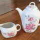 Vintage porcelain coffee or teapot with milk jug