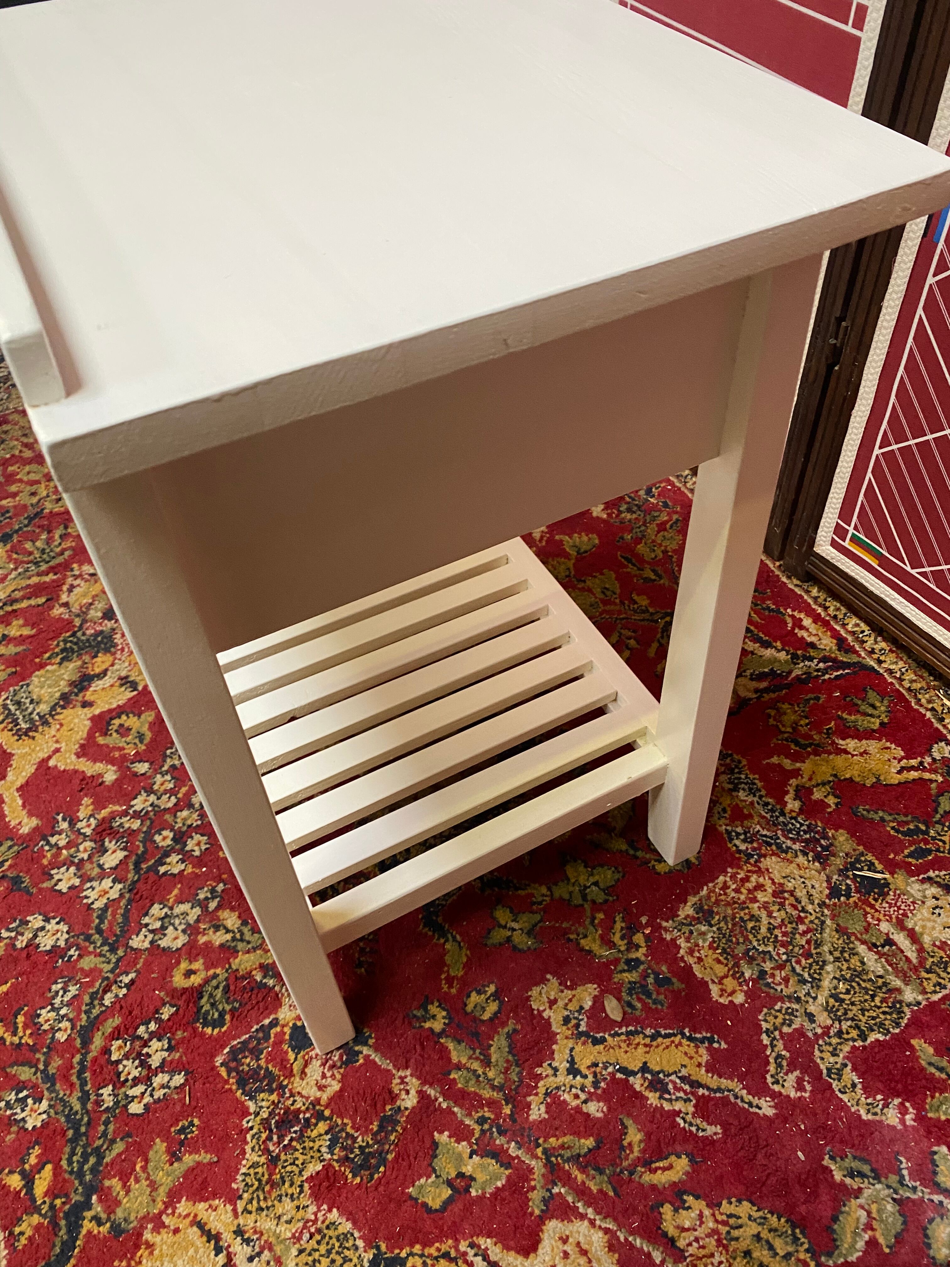 Wooden bedside table painted white