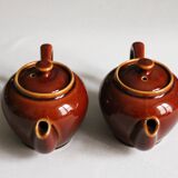 2 brown glazed ceramic teapots