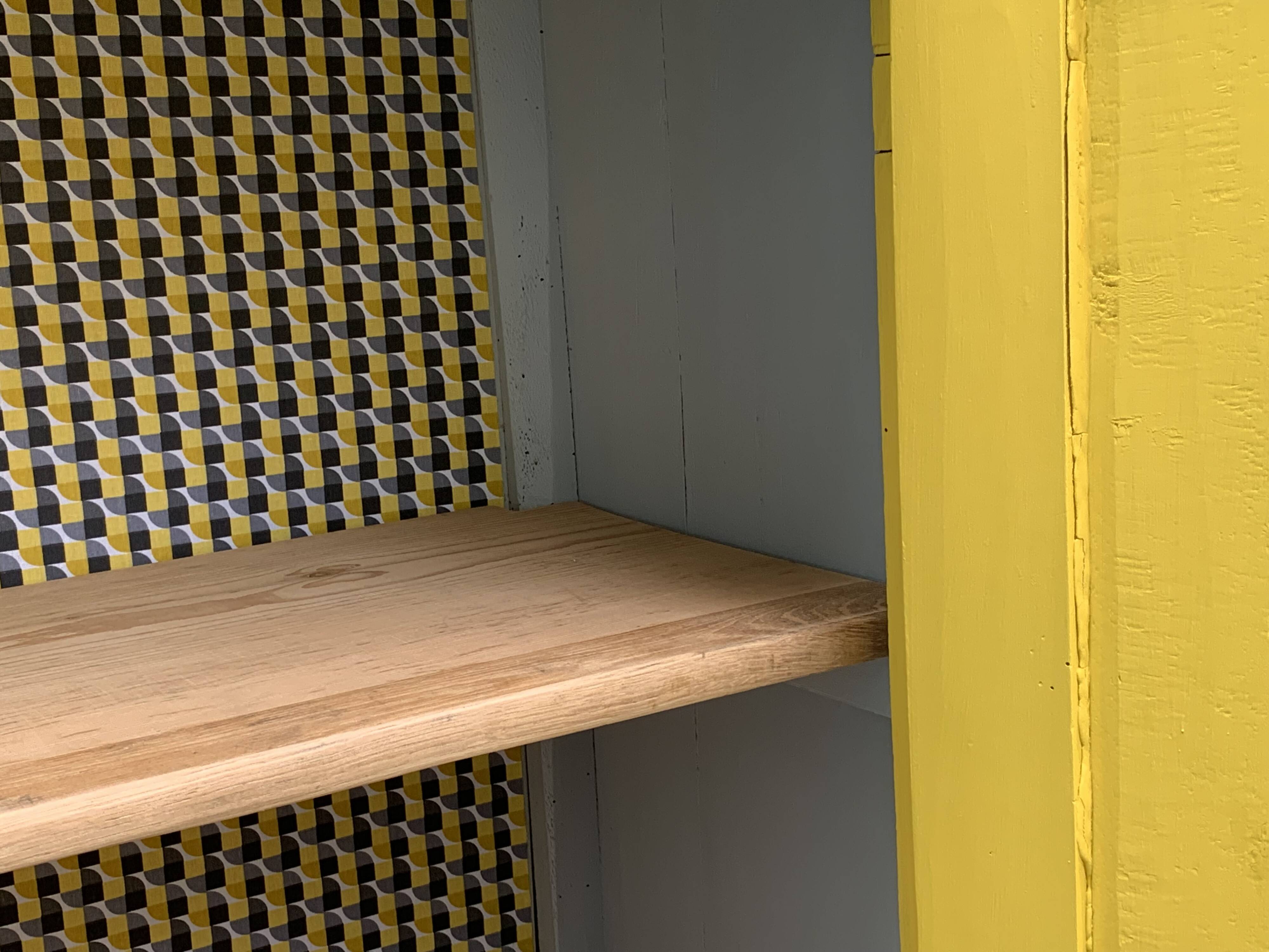 Antique powder yellow Parisian bonnetière wardrobe.