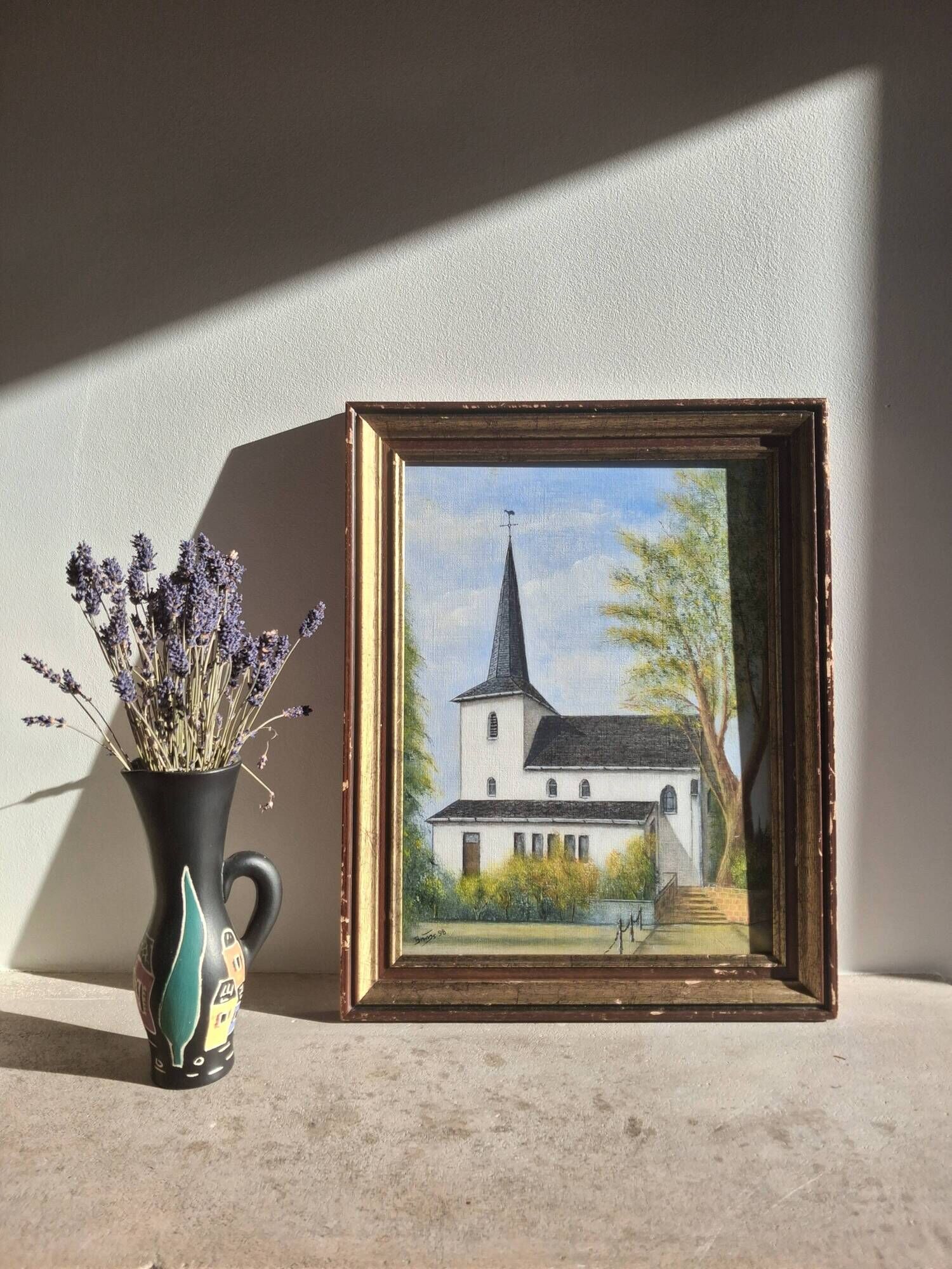 Oil on isorel depicting a church from Northern Europe.