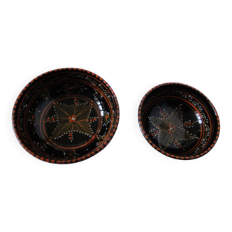 Pair of cups different sizes black background graphic decor