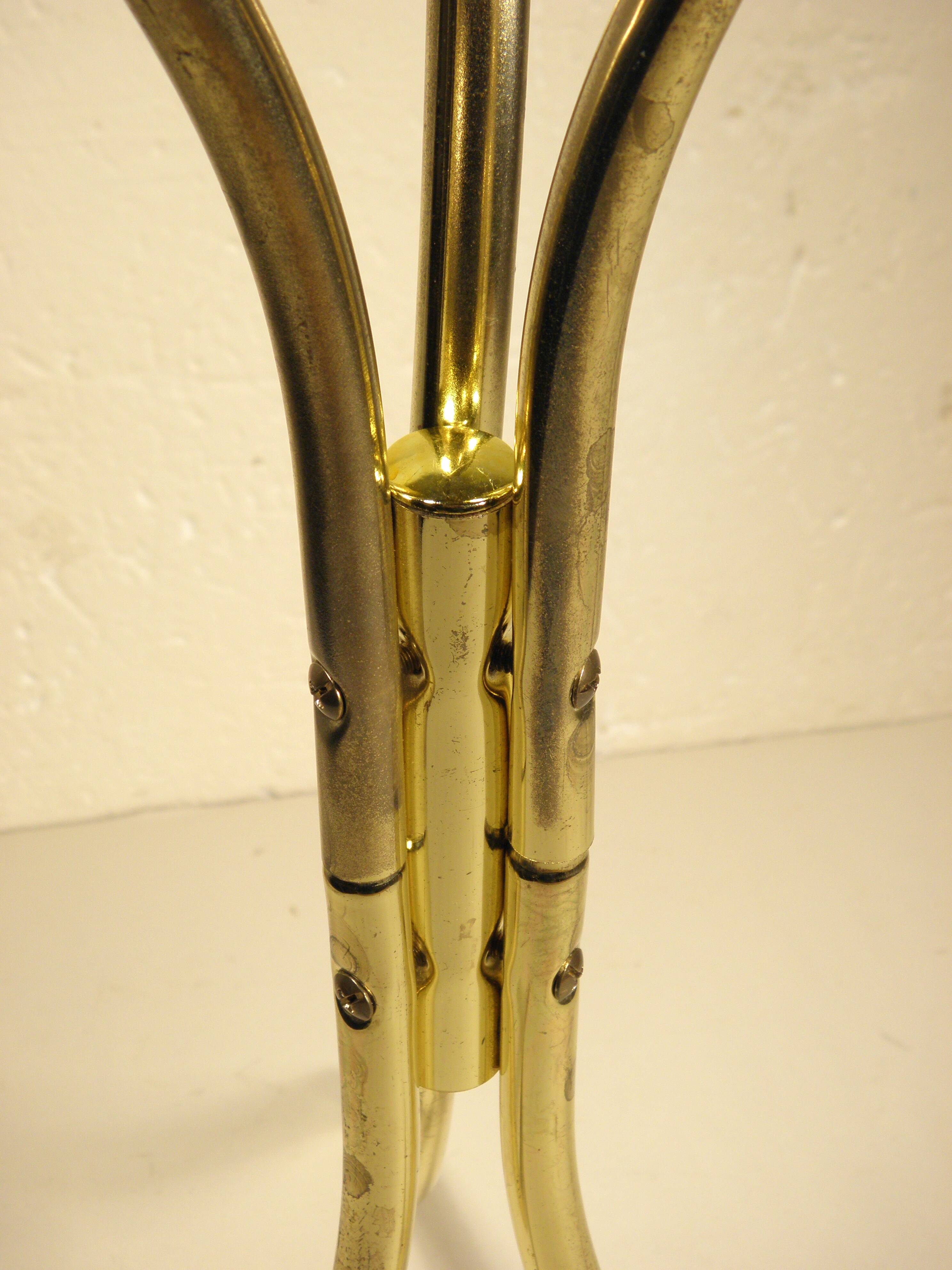 Tripod stand in gold metal and glass