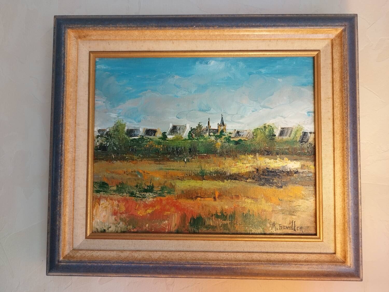 Oil on canvas "a Village in Brittany" signed by Raymond Scuiller