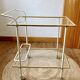 Dessert table with a cream-coloured metal structure and gold brass, 1960s.