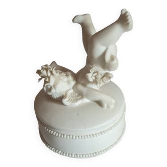 Small round box topped with a vintage biscuit porcelain angel
