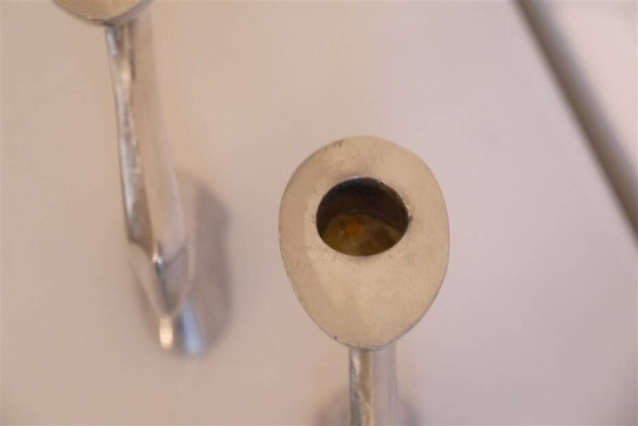 Pair of aluminium cast candle holders