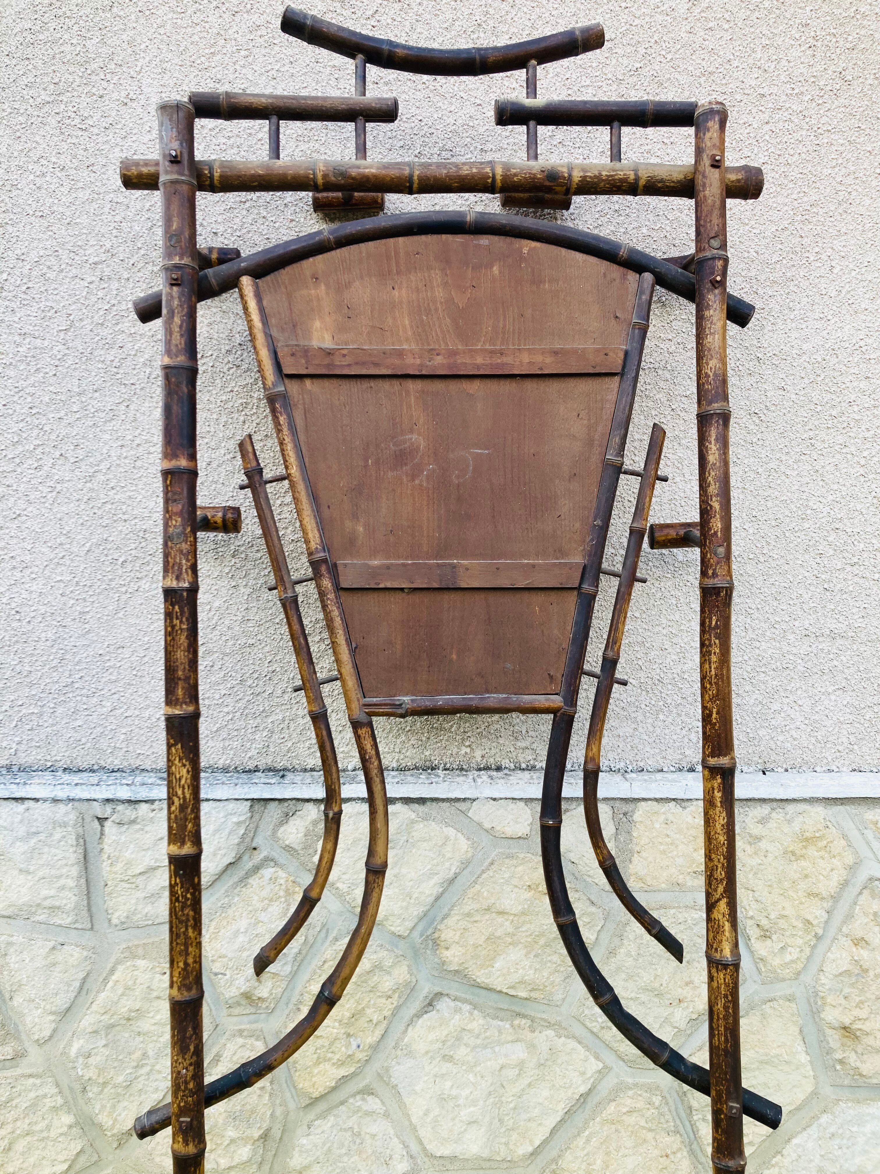 Bamboo coat rack from the 19th century, mirror in the shape of a crescent moon.