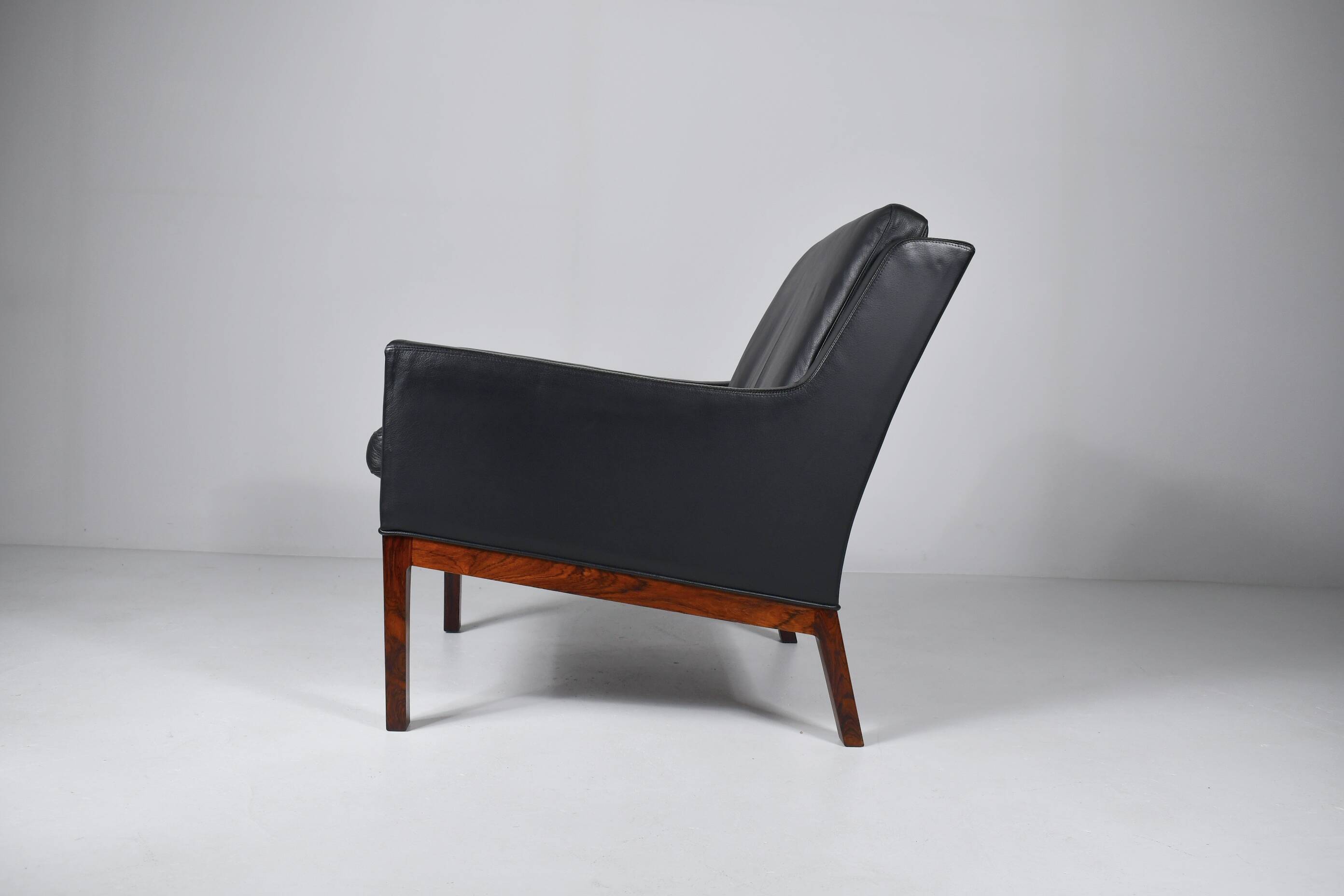 Leather and rosewood armchair by Kai lyngfeldt-Larsen. Denmark