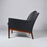 Leather and rosewood armchair by Kai lyngfeldt-Larsen. Denmark