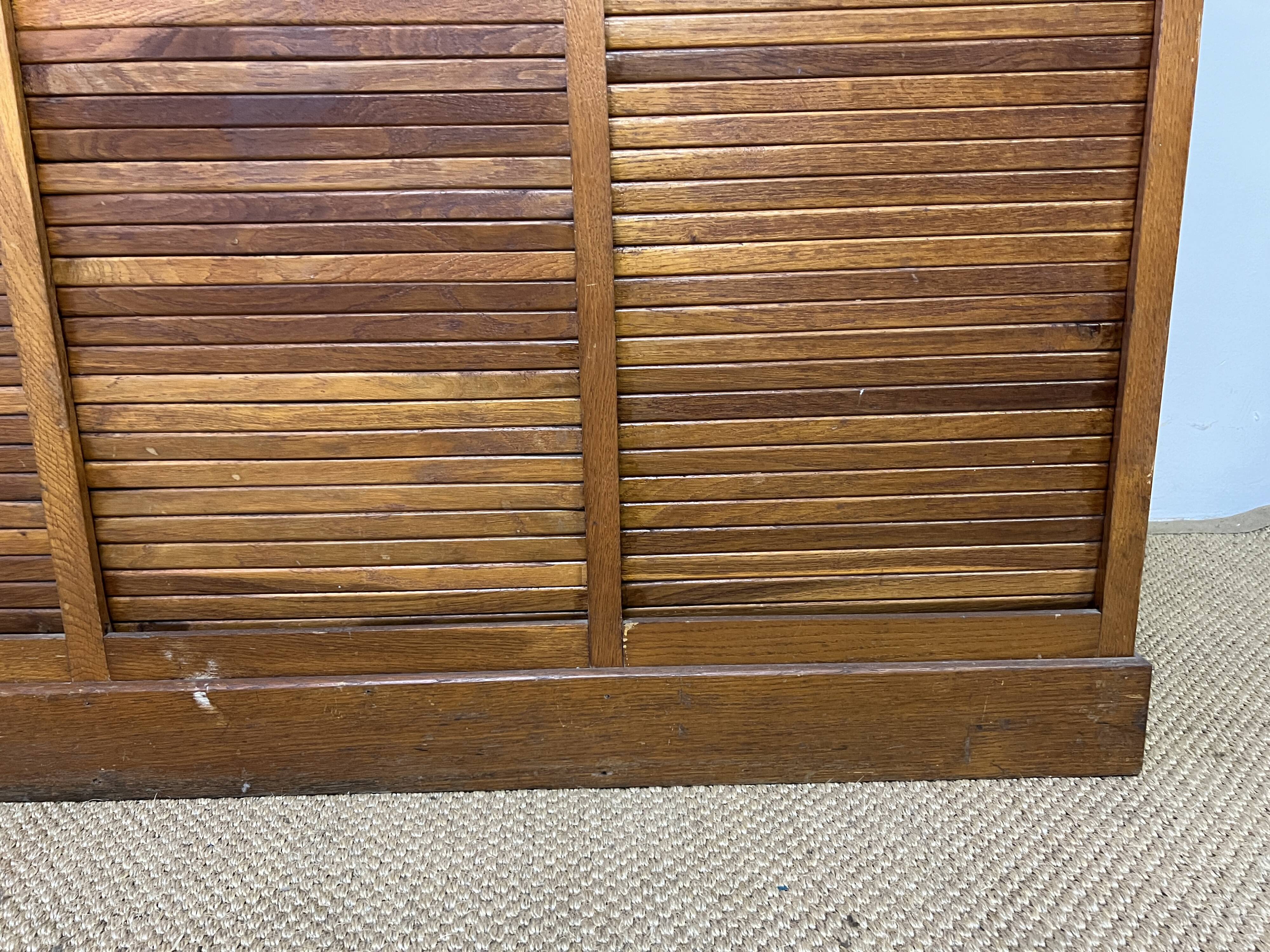 Old filing cabinet with triple curtains