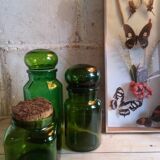 Trio of green glass apothecary bottles
