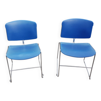 pair of blue max stacker steel case chairs