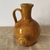 Provençal jug in orange/caramel glazed earthenware