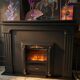 Luxury electric fireplace and classic black mantel suite