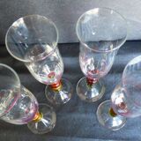 4 vintage flutes with coloured glass stems