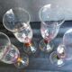 4 vintage flutes with coloured glass stems