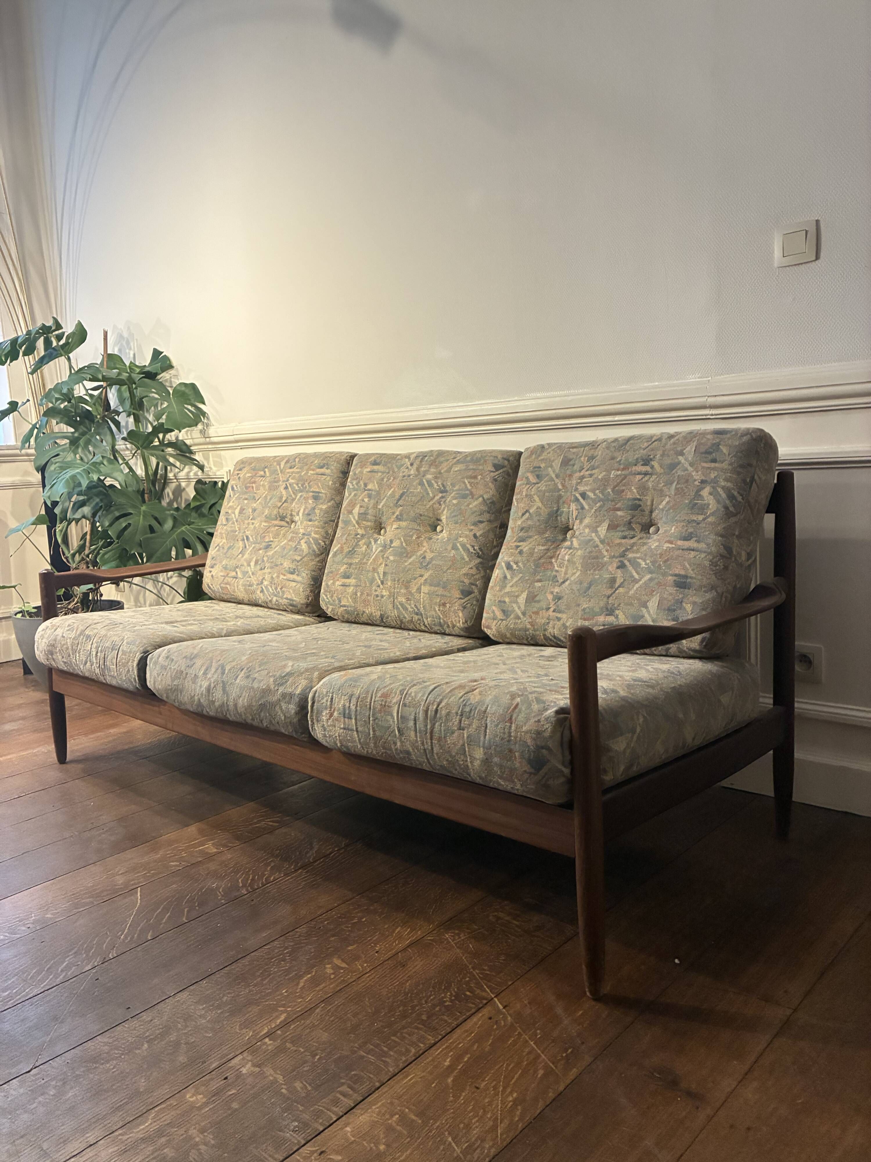 Vintage three-seater sofa — wood and sculptural backrest