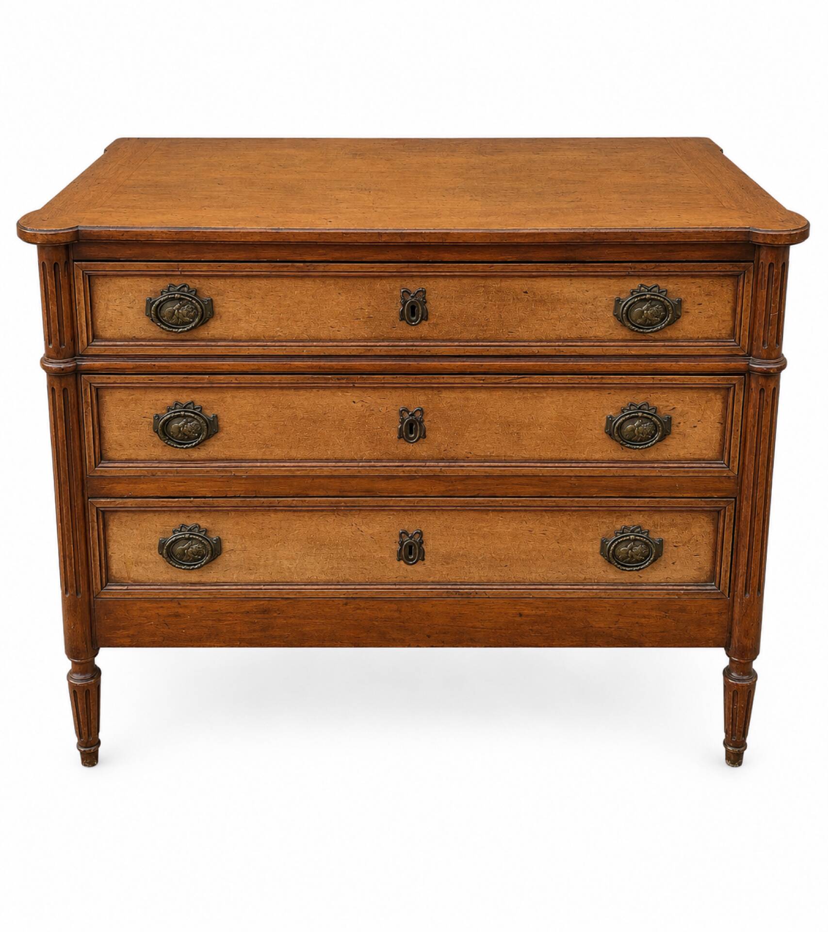 Light walnut commode in Louis XVI style with fluted motifs and three drawers.