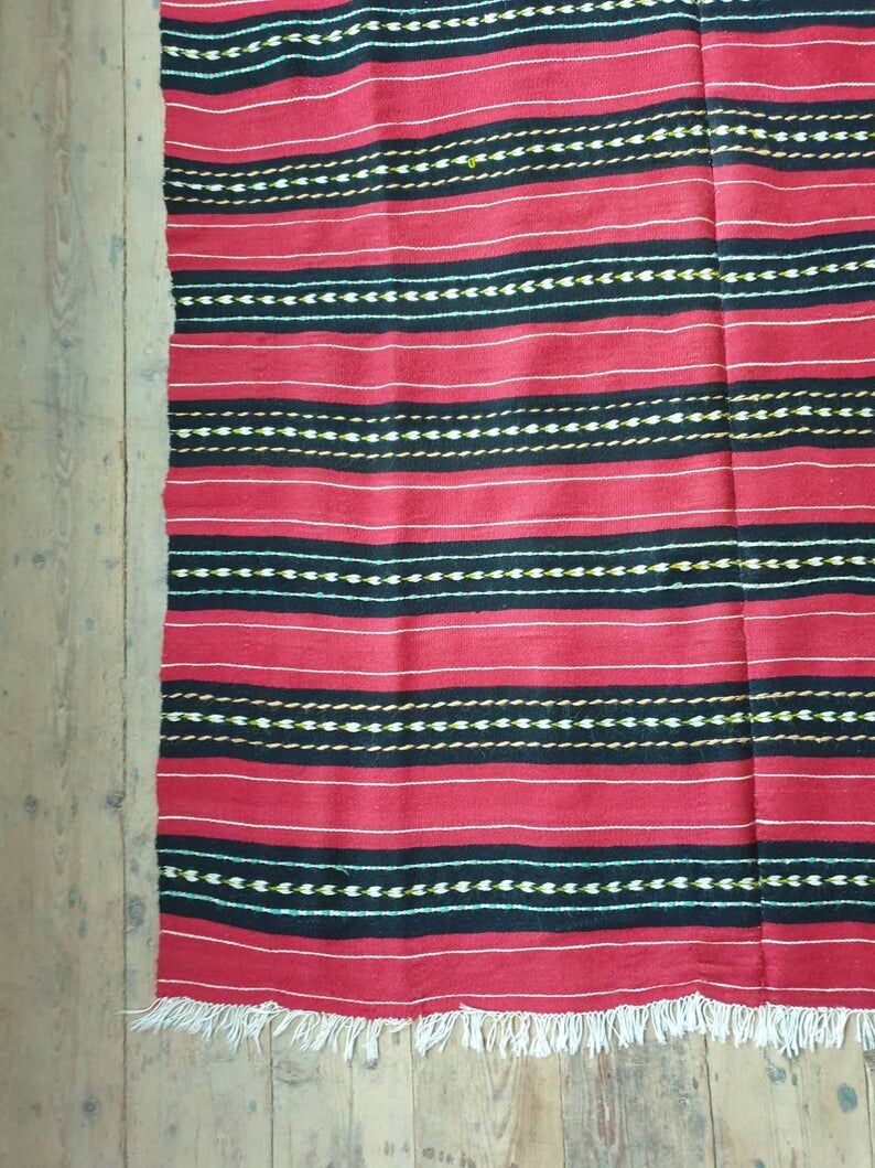 Hand-woven red wool rug