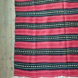 Hand-woven red wool rug