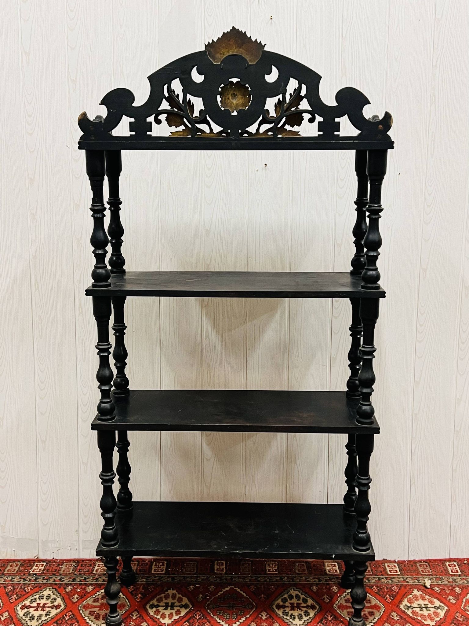 Blackened wooden shelf.