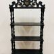 Blackened wooden shelf.