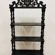 Blackened wooden shelf.