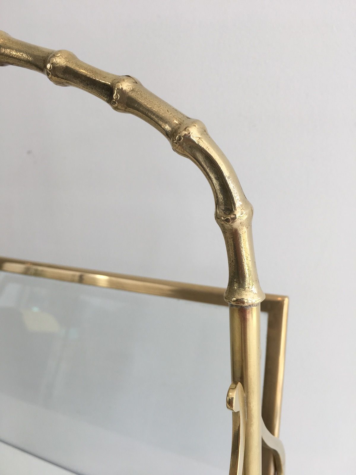 Bamboo-style brass magazine rack from the Baguès house.