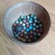 70 terracotta balls and a metal calot