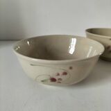 Two large vintage bowls in pastel decor on mini pedestals.