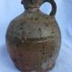 Ancient jug in glazed sandstone