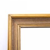 Large mirror in gold frame.