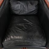Black cowhide leather and wooden Art Deco design armchair
