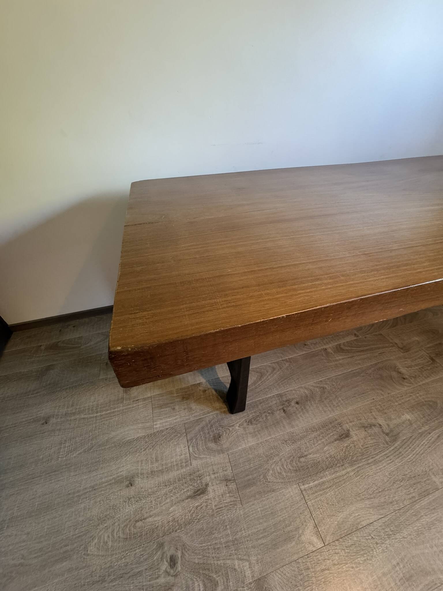Industrial style table with a mahogany top.