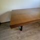 Industrial style table with a mahogany top.