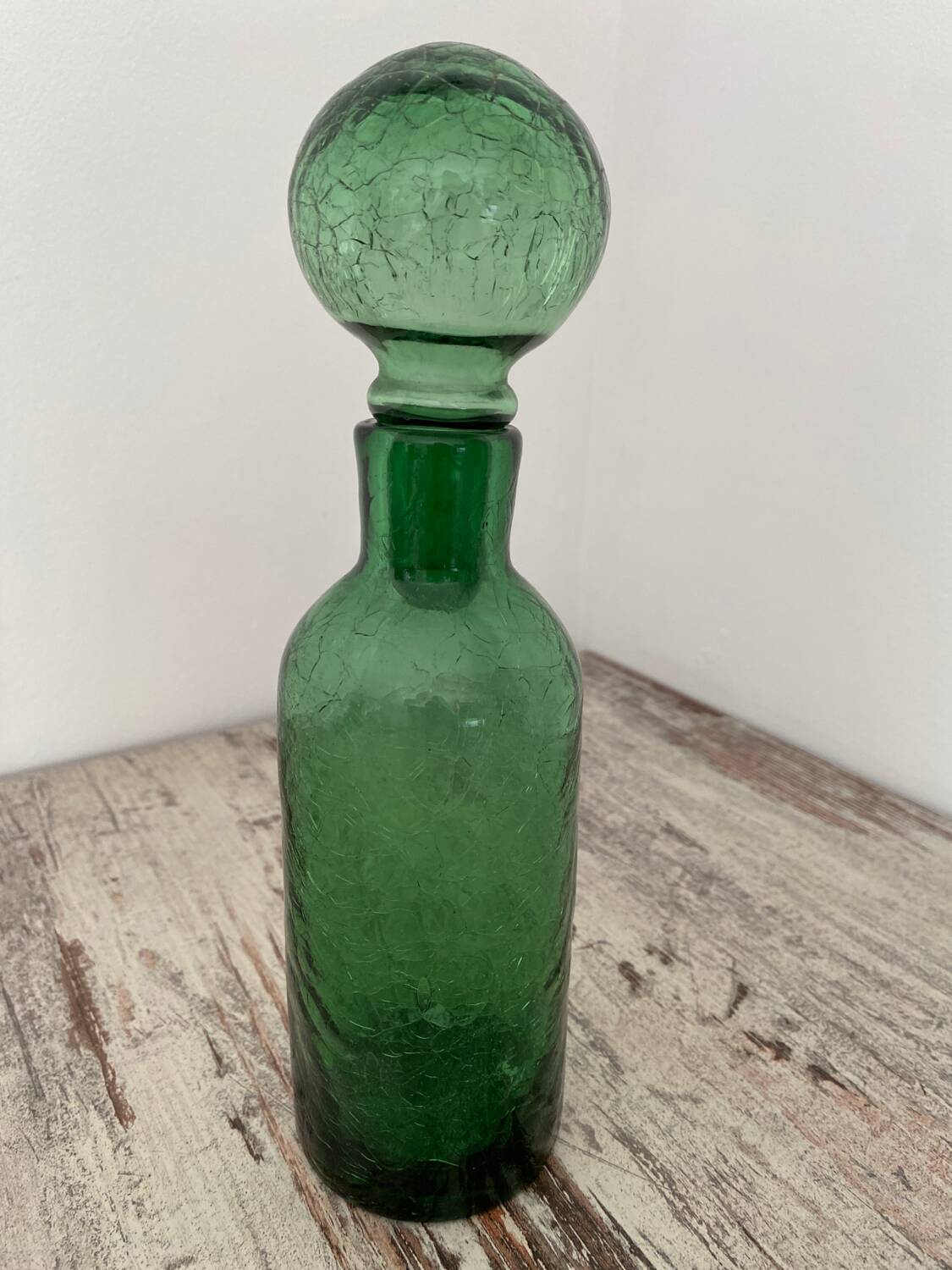 Old cracked glass carafe