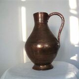 Skidded copper pitcher