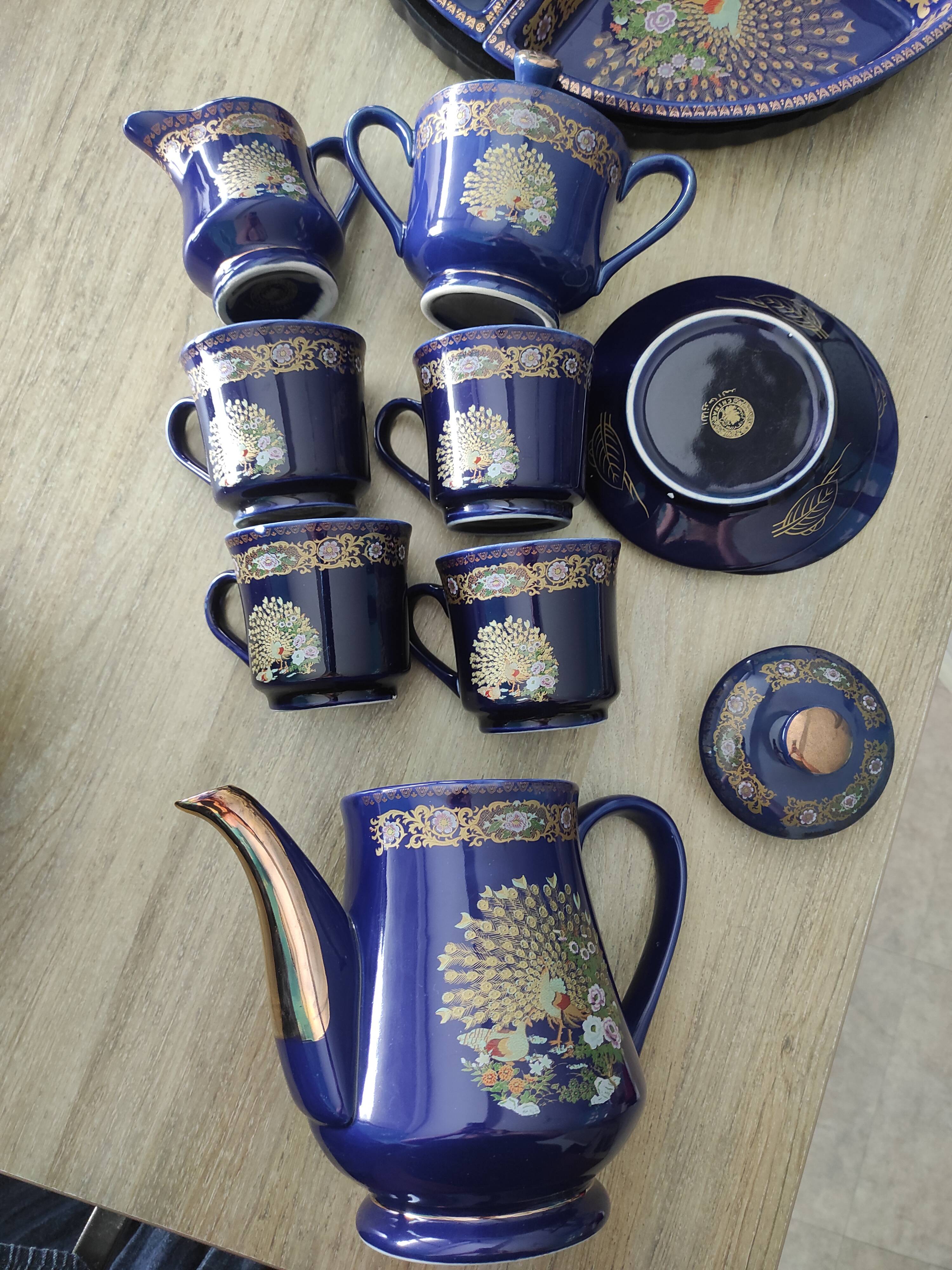 Vintage blue Taous dinnerware set of 21 pieces in very good overall condition.