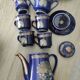 Vintage blue Taous dinnerware set of 21 pieces in very good overall condition.