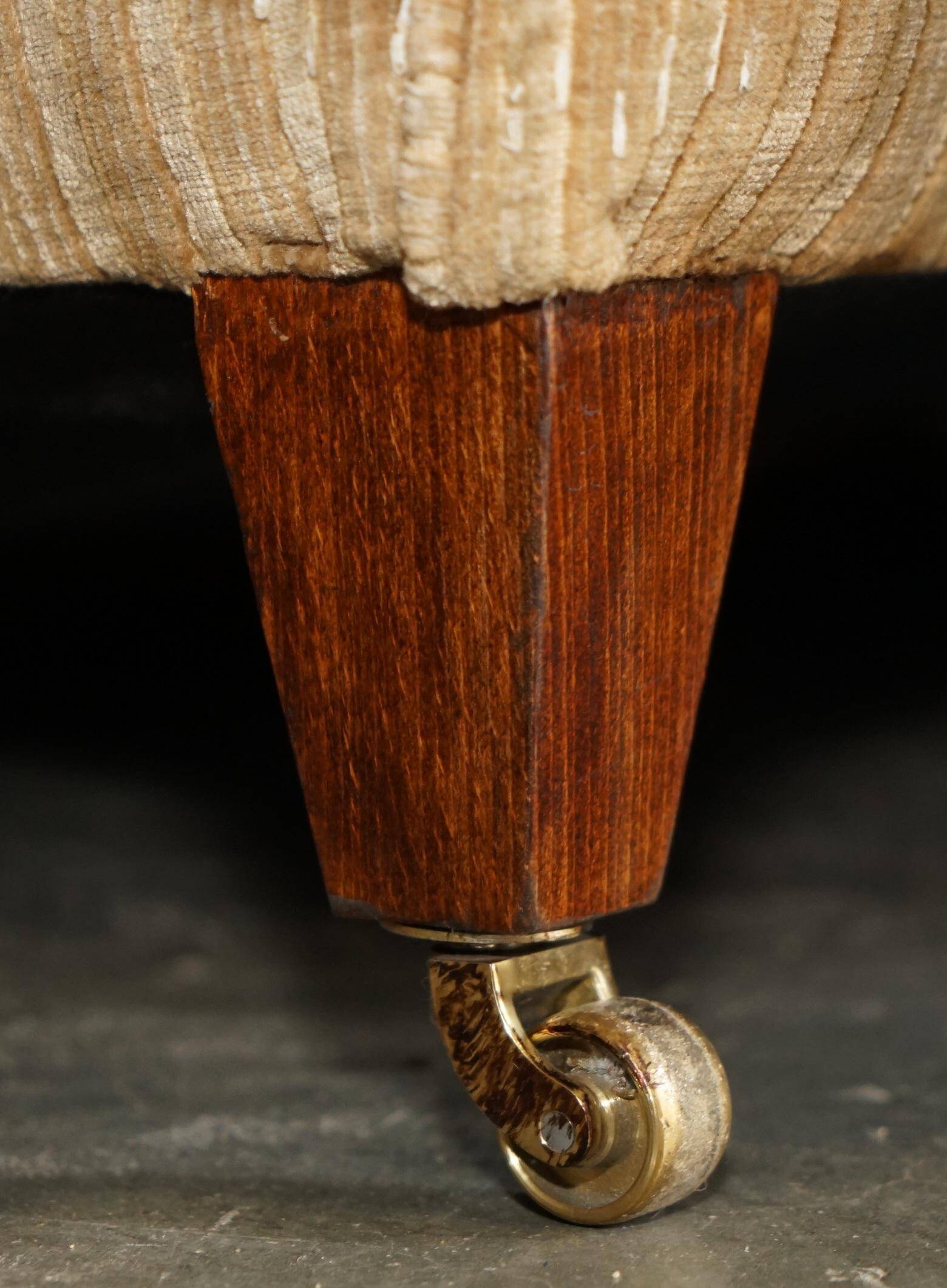 Howard & Sons / Chairs Ltd two-seater canapé with feather-filled cushions.